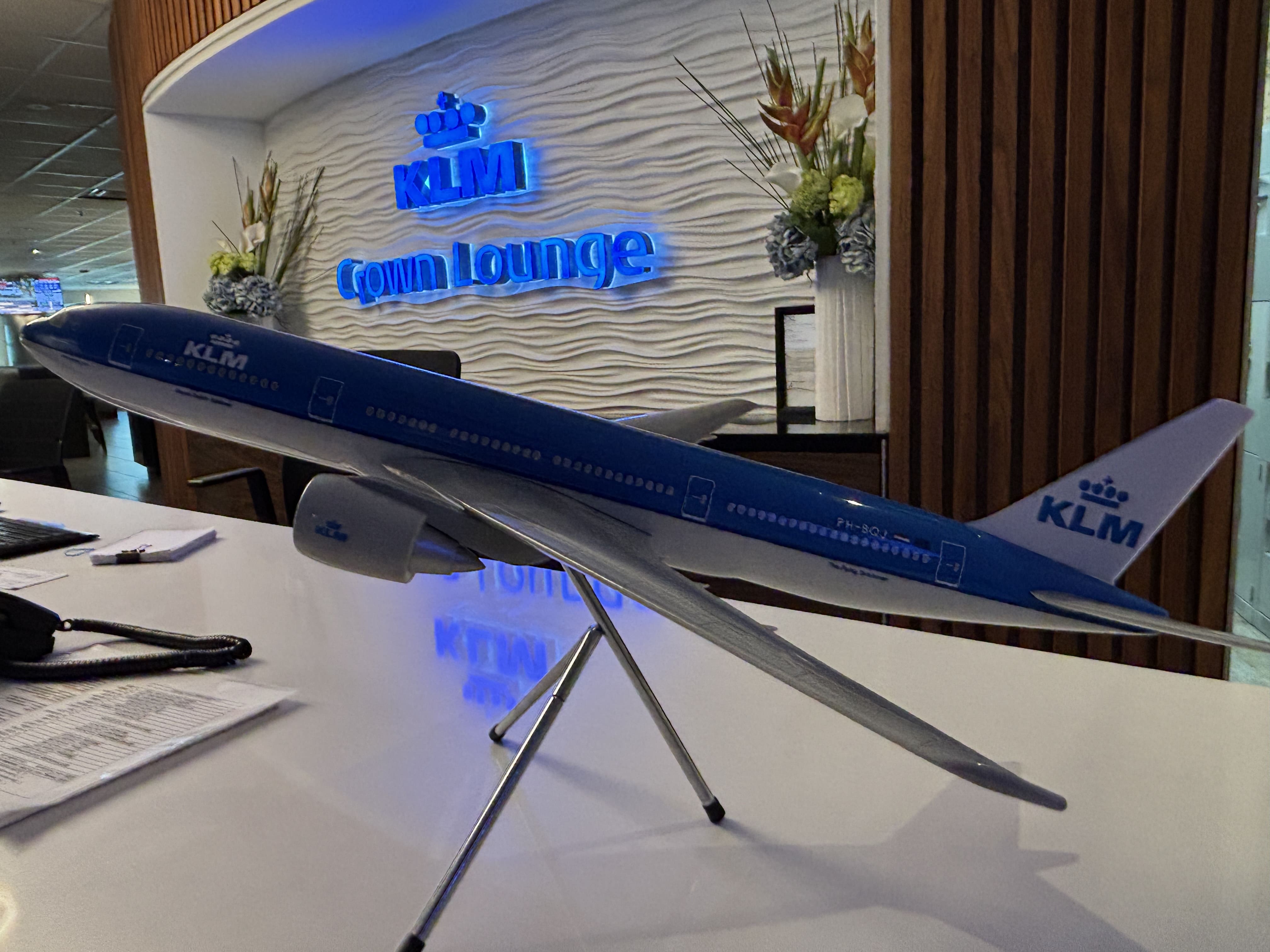 KLM aircraft model on display at the reception desk of the Crown Lounge Toronto.