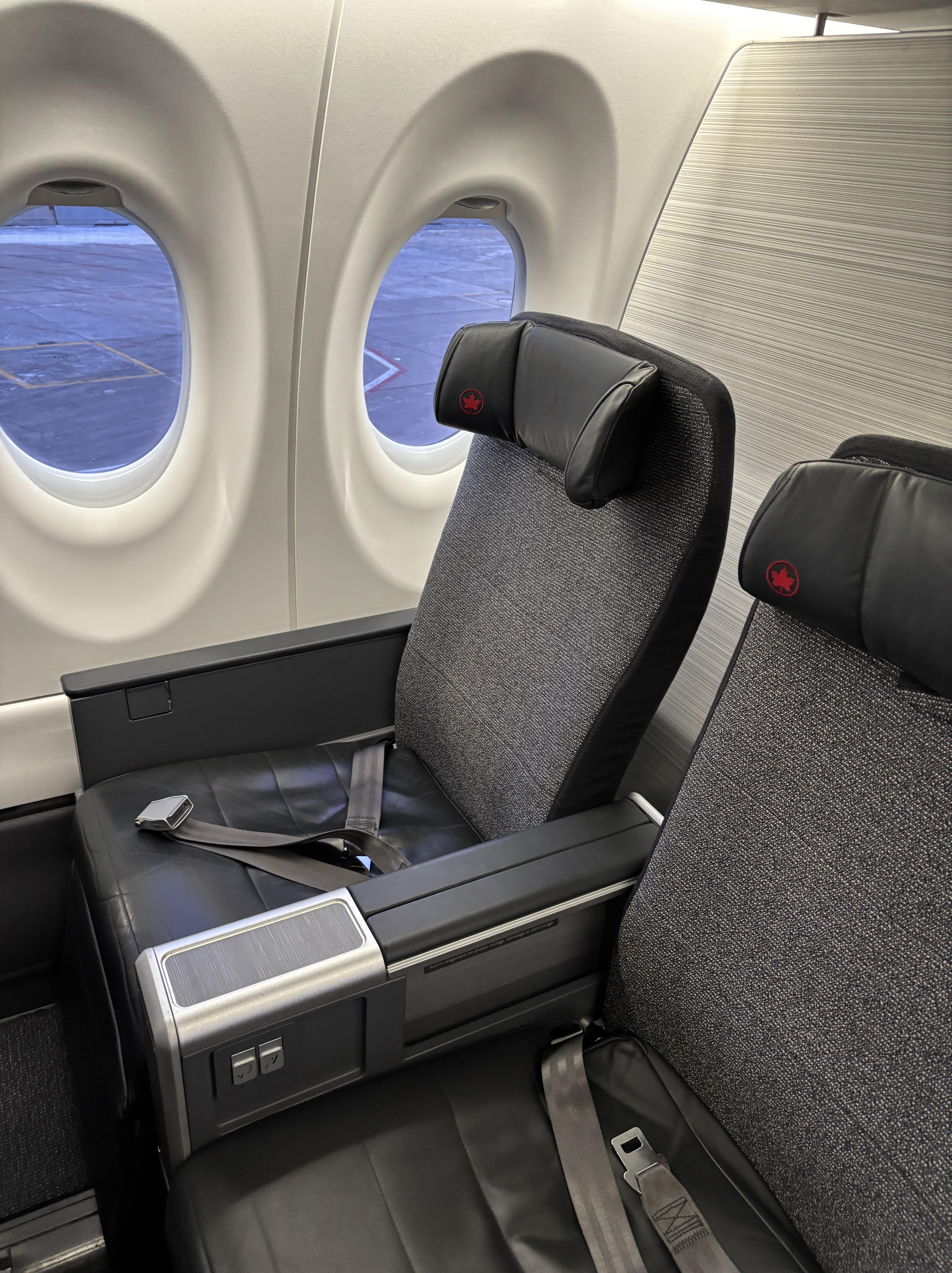 A pair of business class seats on an Air Canada A220.