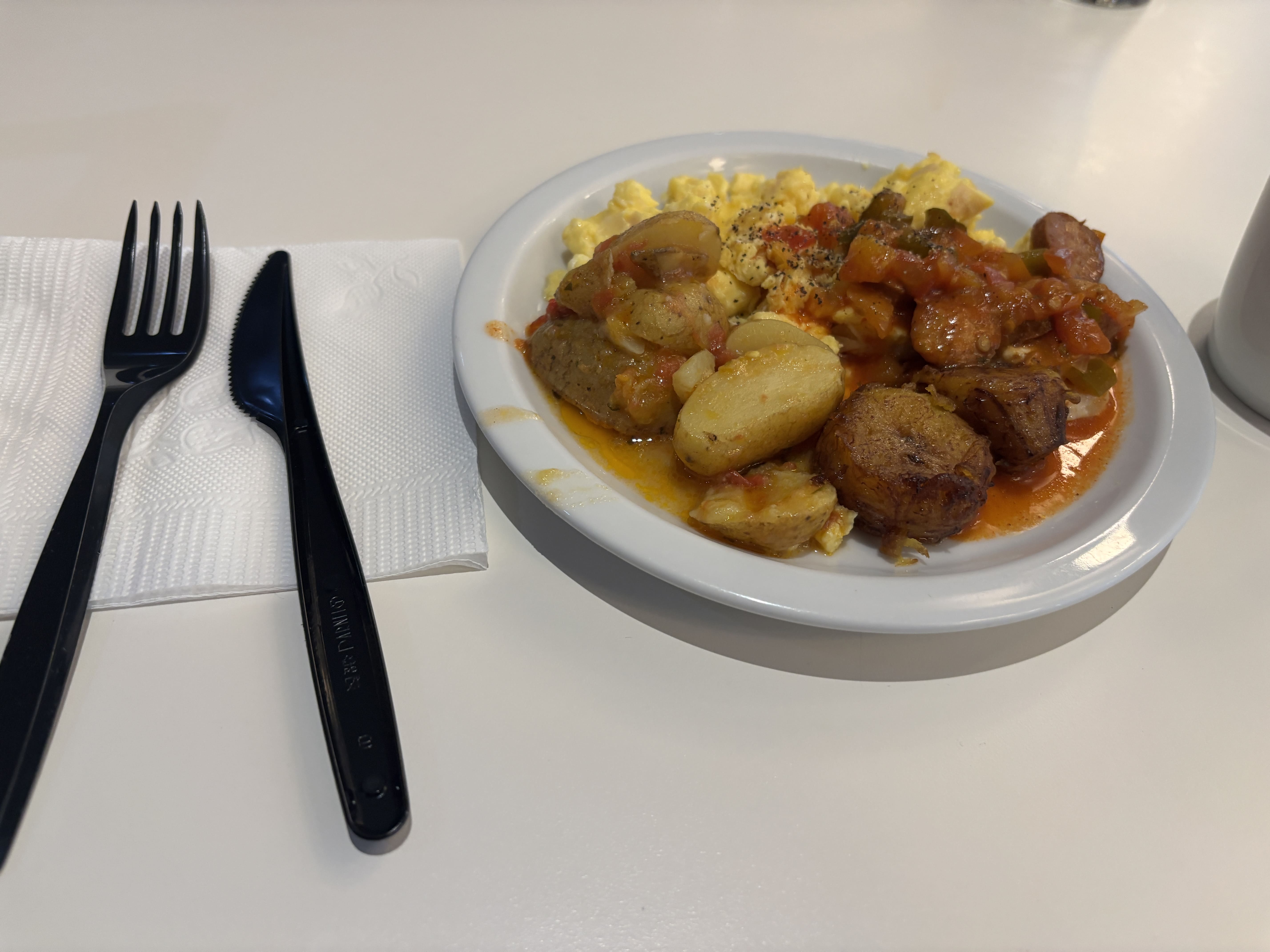 Small plate of food at the Avianca lounge in El Salvador.