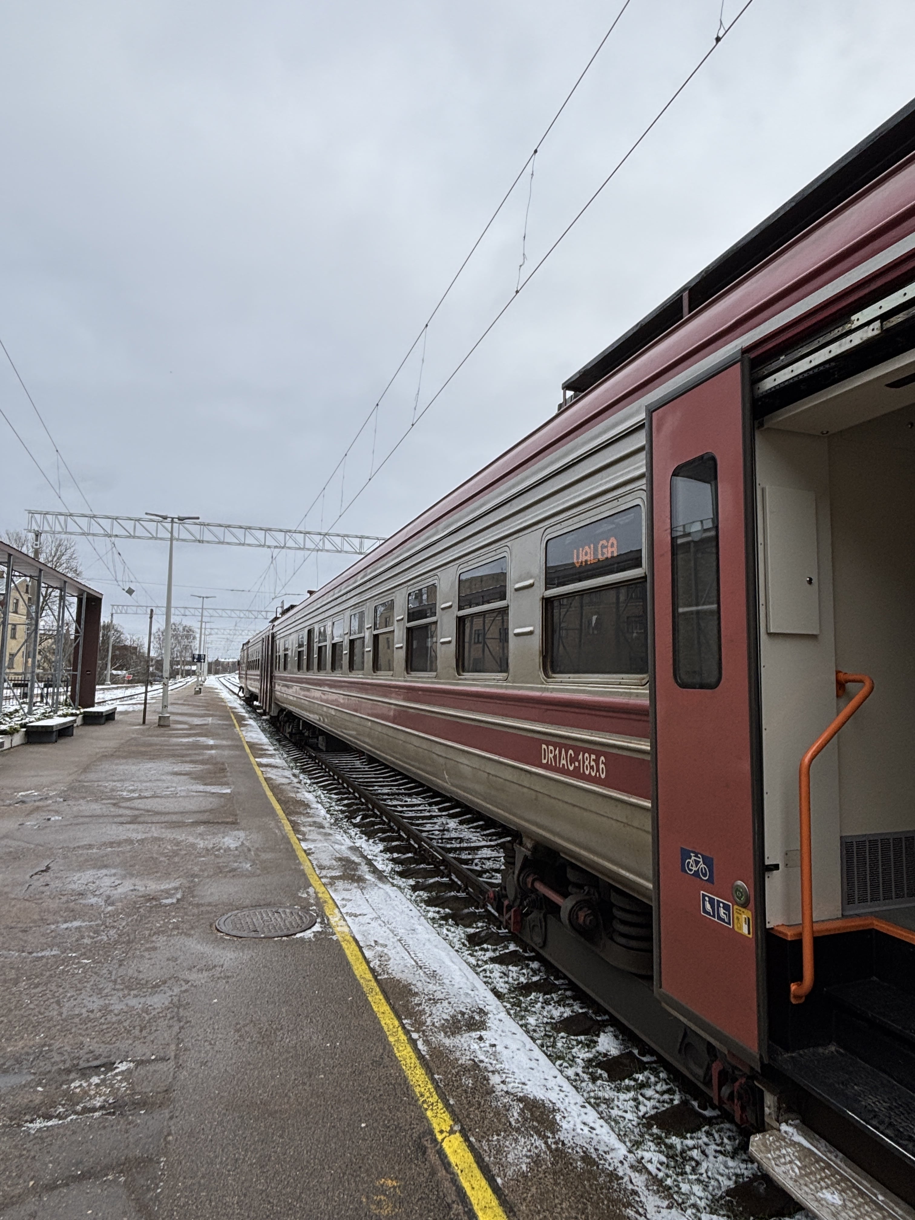 Train with open doors at Riga station.