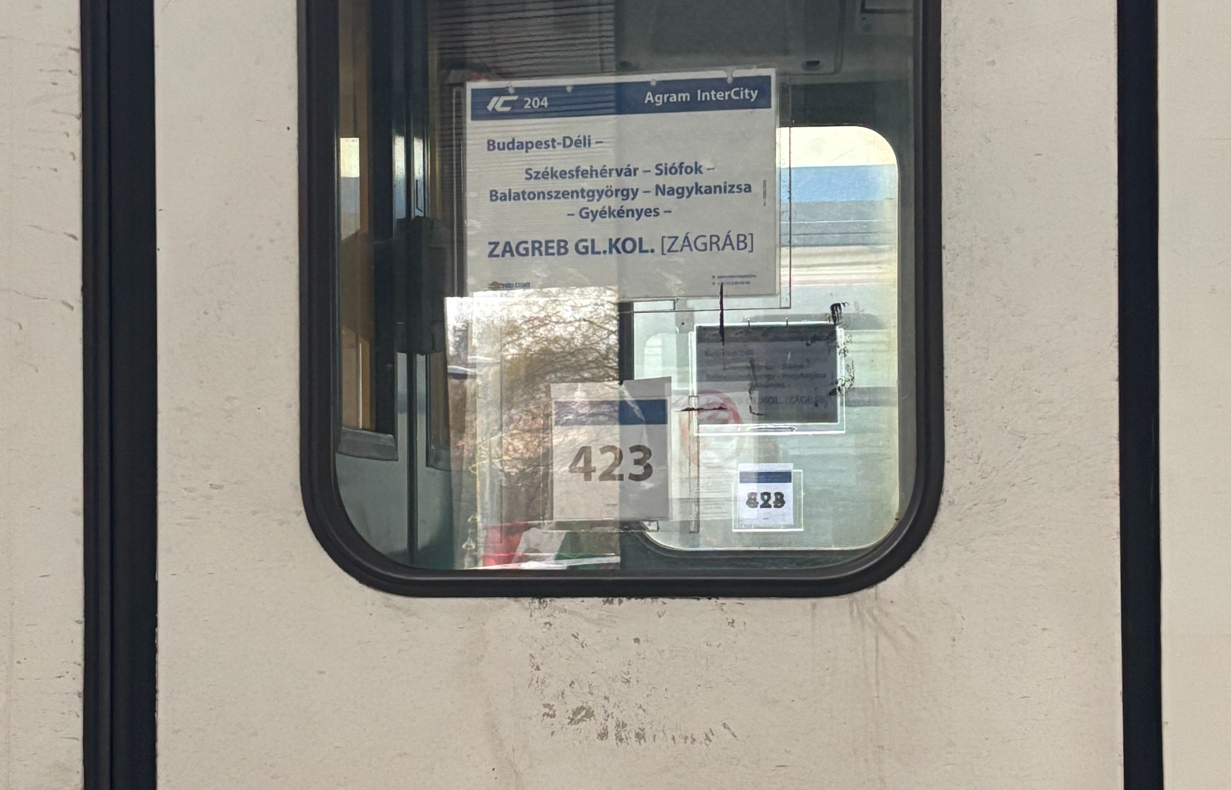 Sign on coach door listing Zagreb as its final destination.