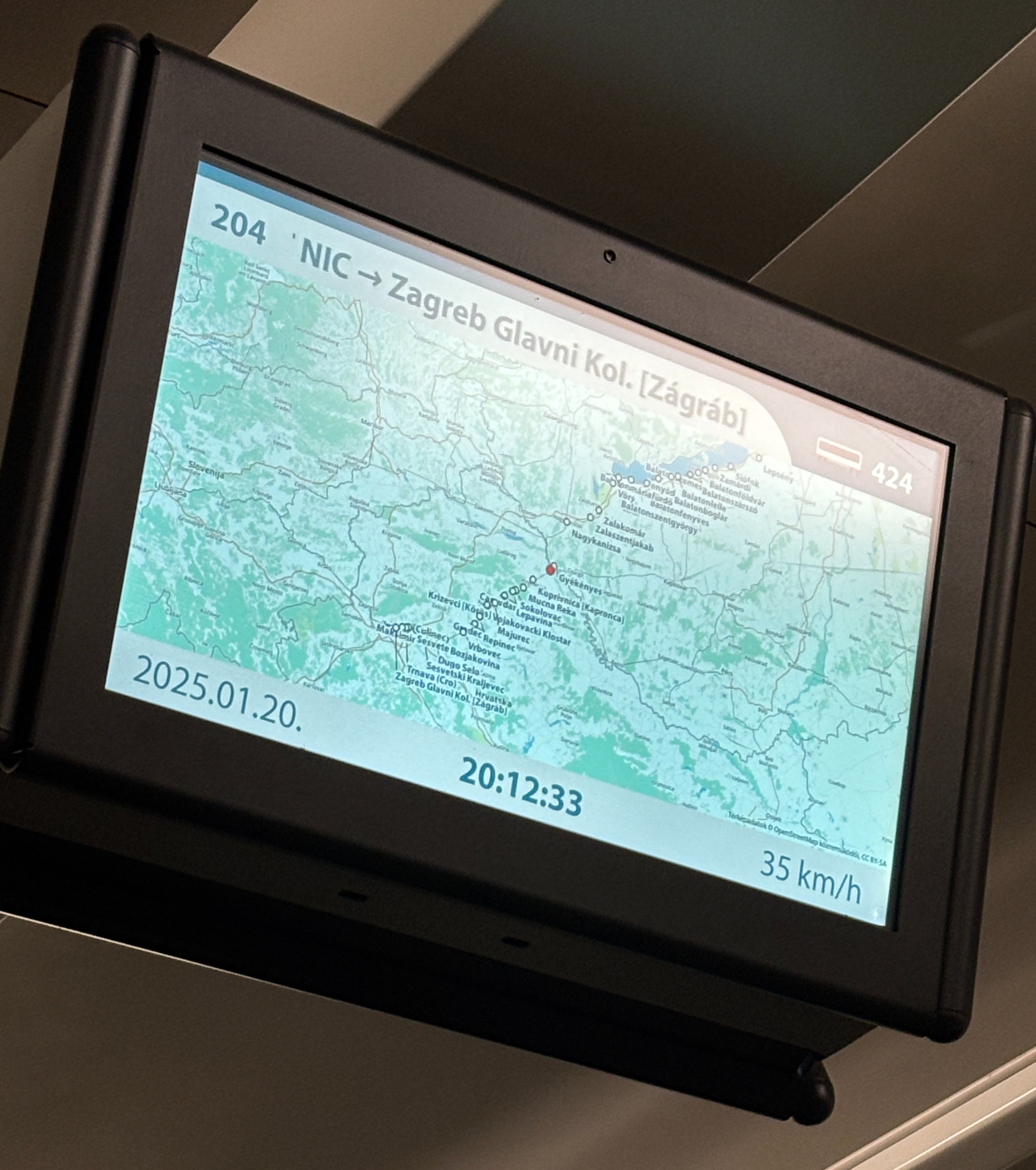 Display screen showing speed, location, and upcoming stops.