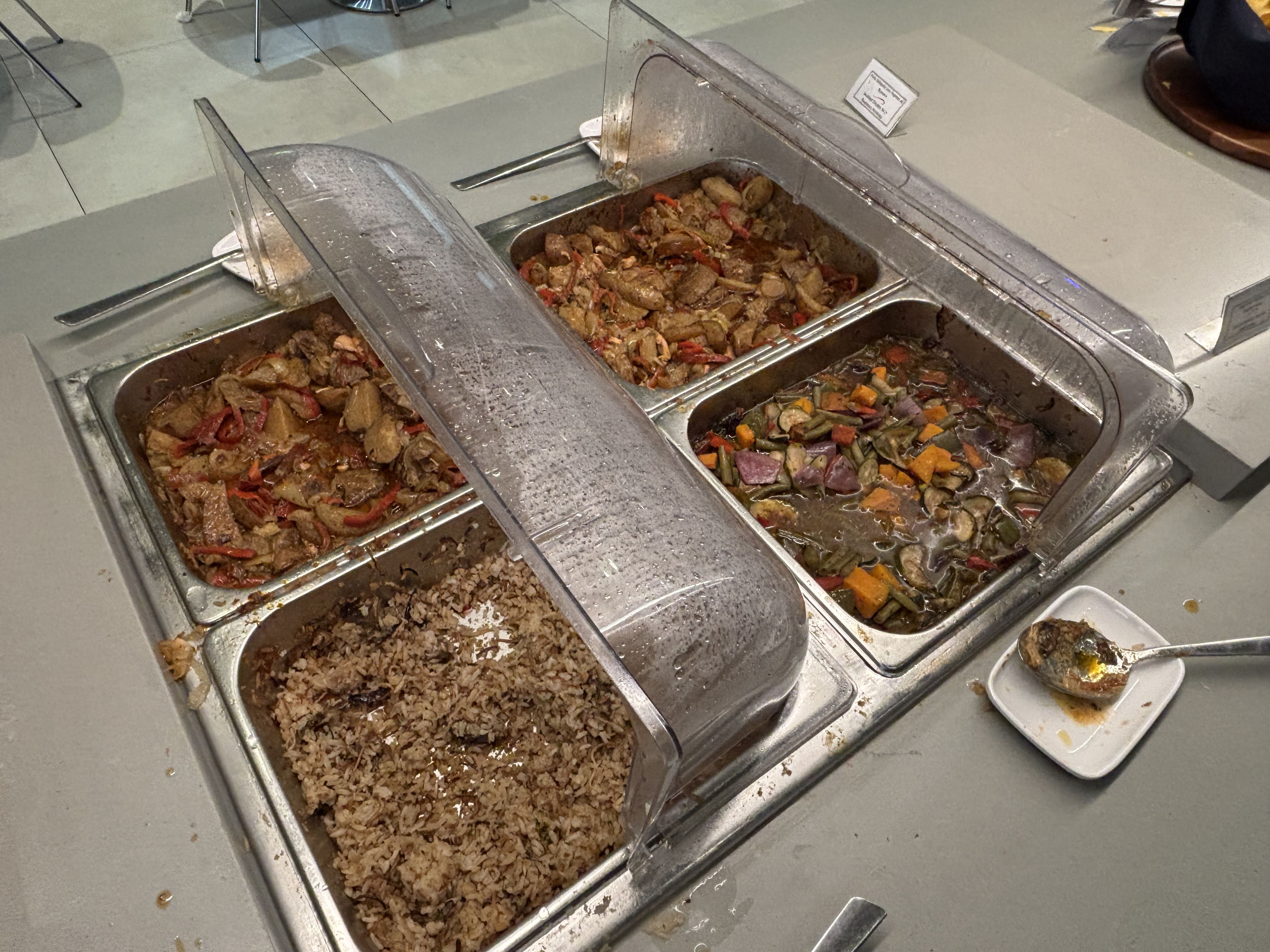 Hot food options in the Copa Club: chicken, potato, rice, and vegetables.