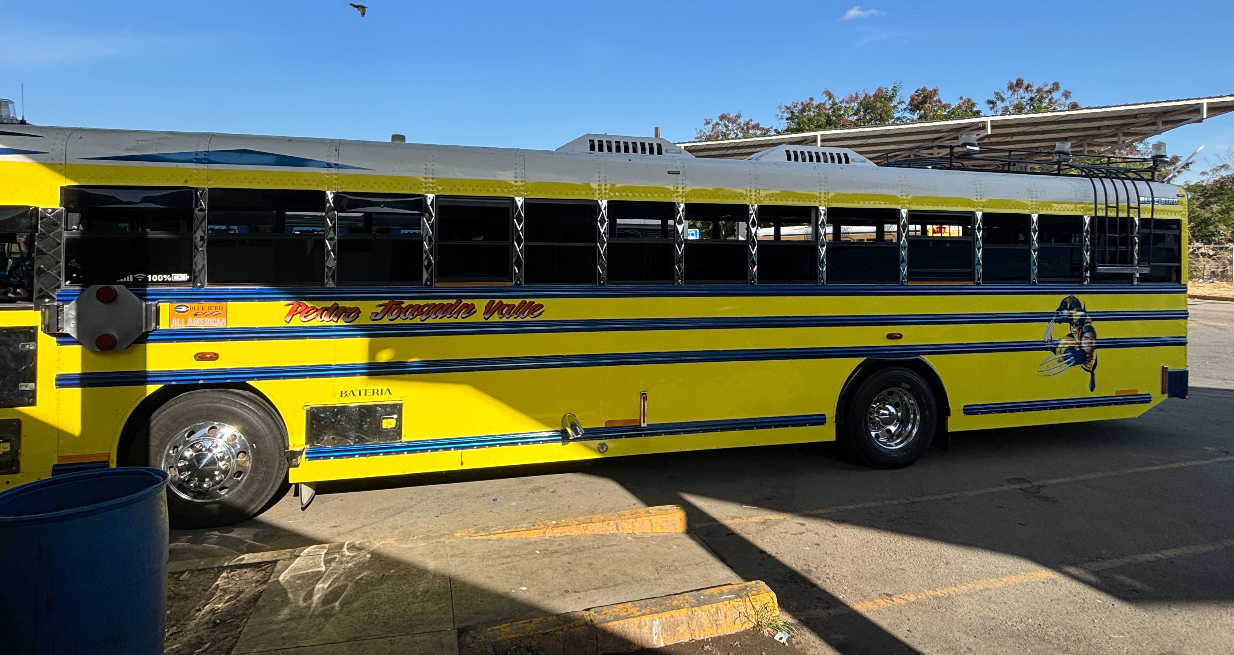 A repainted school bus waiting at the Peñas Blancas bus terminal in Nicaragua.