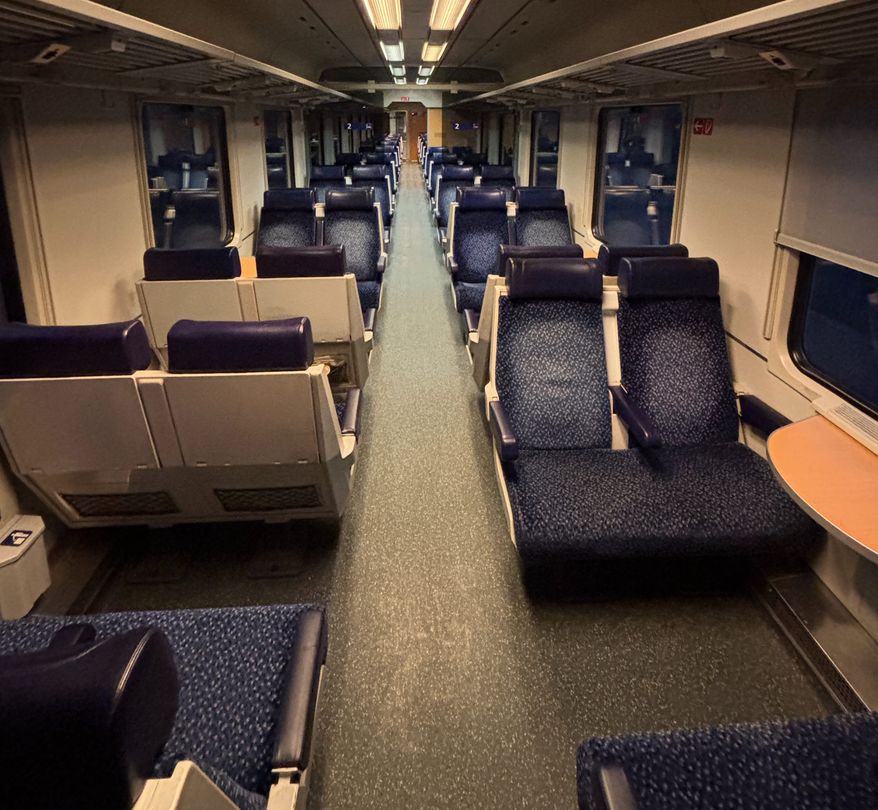 Second class seats in an empty carriage.