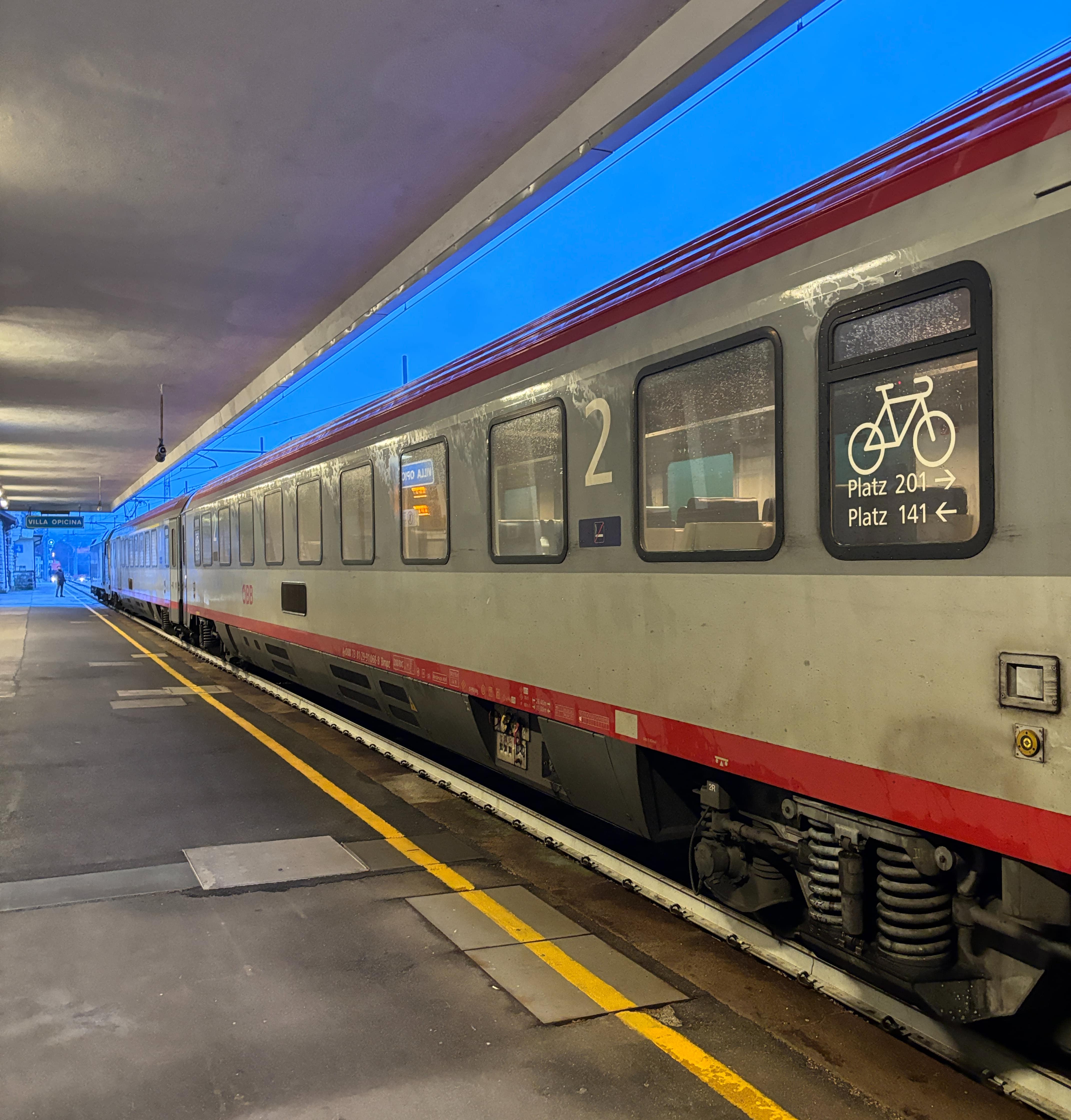 Train waiting at an empty platform.