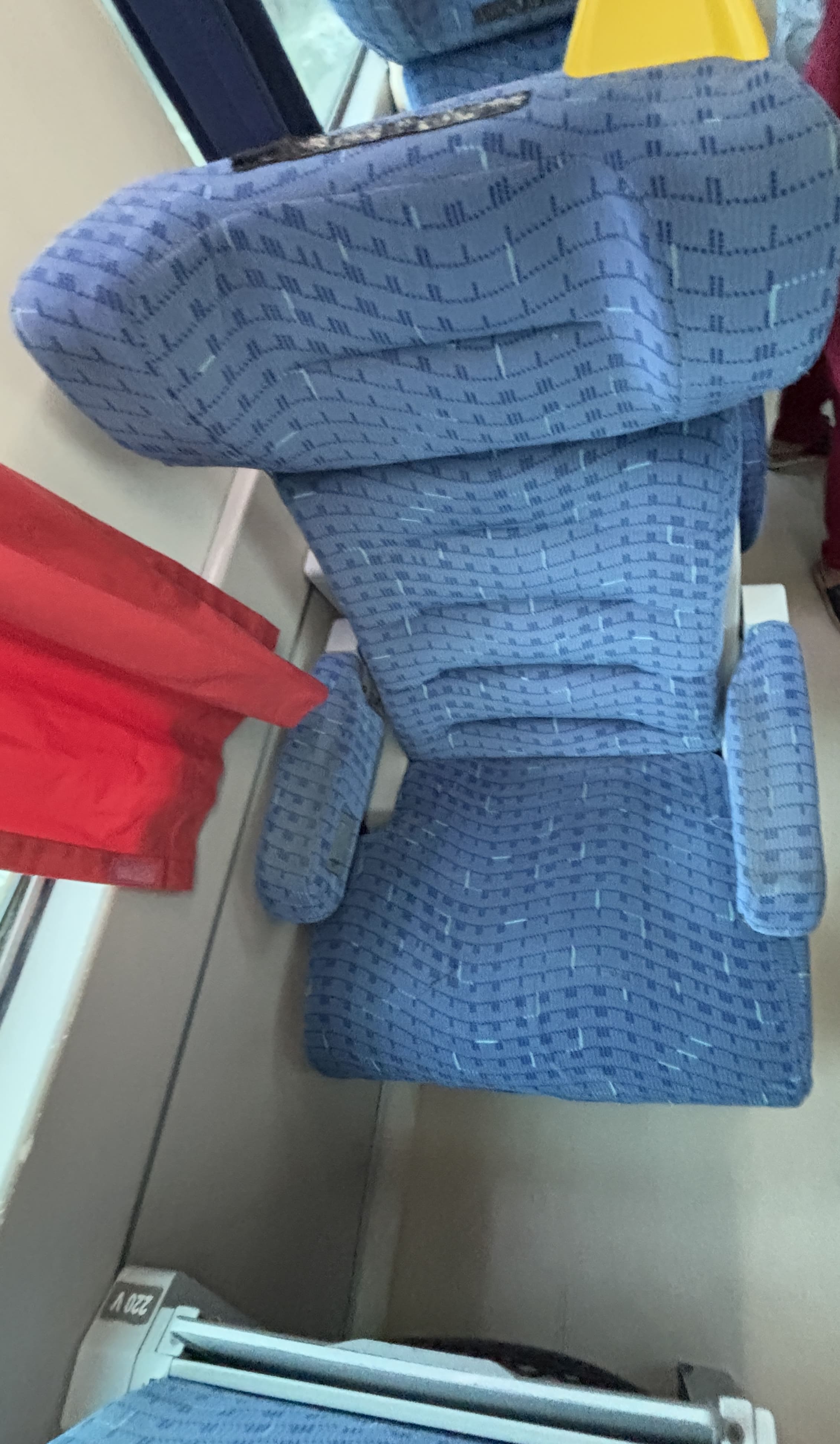 Image showing the executivo solo seat aboard Vale's passenger trains, with well-padded blue upholestery.