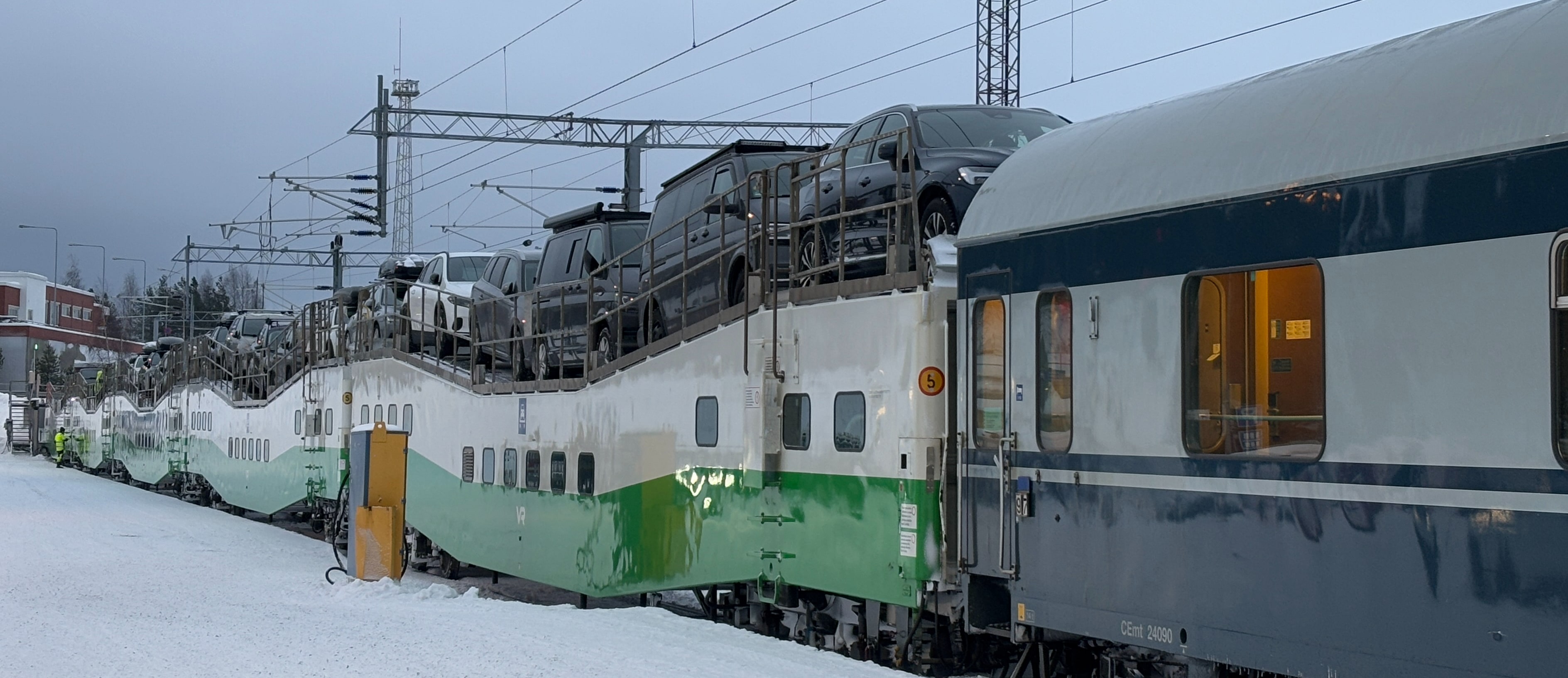 Cars lined up atop dedicated rail cars.
